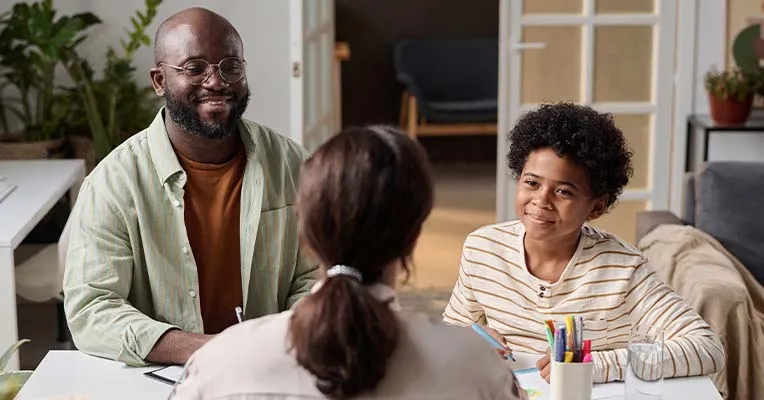 Father and son working with a lawyer